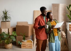 Happy tenants smiling into their new home